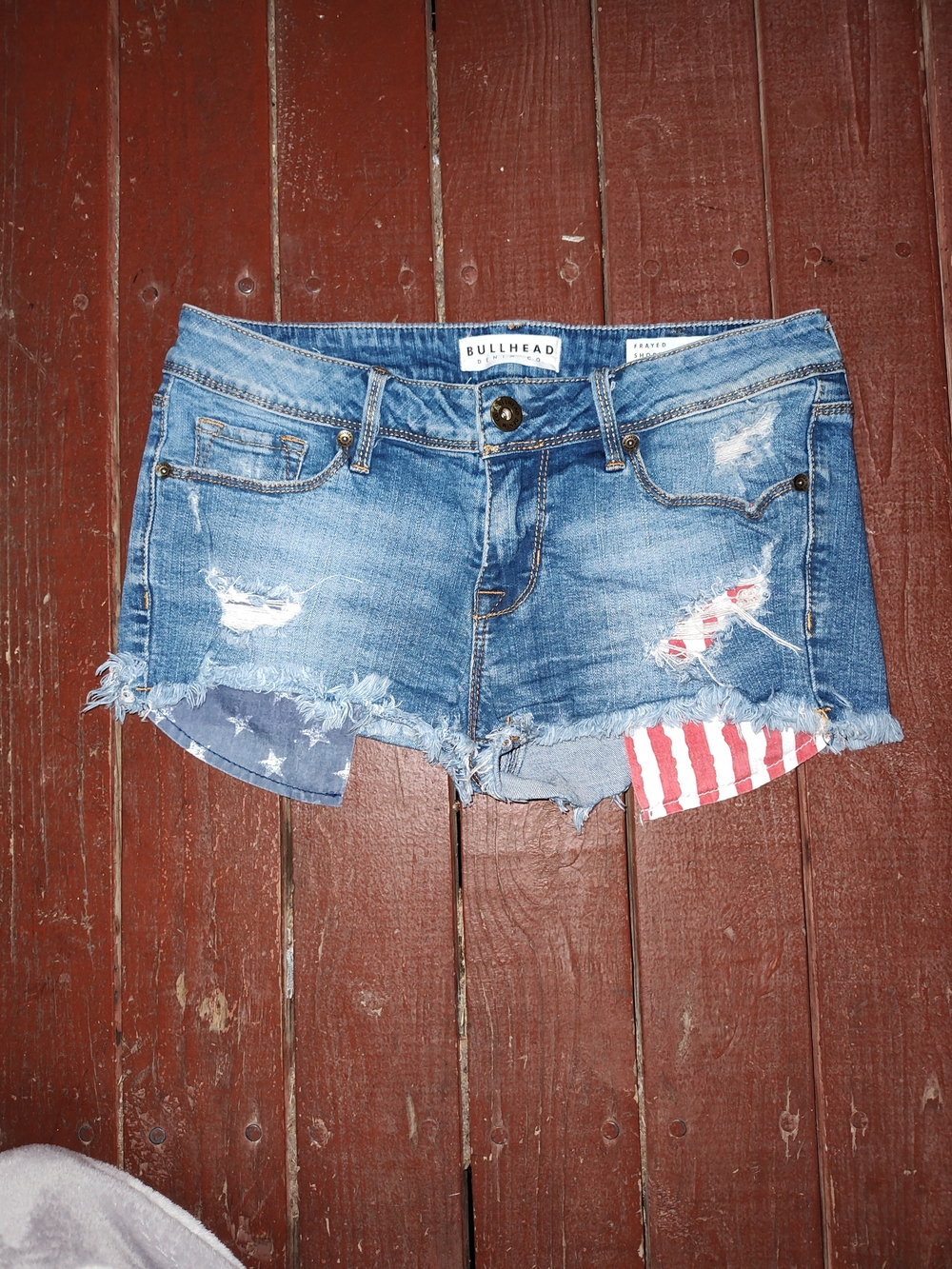 Bullhead Blue Distressed Denim Shorts with Flag Patch Detail